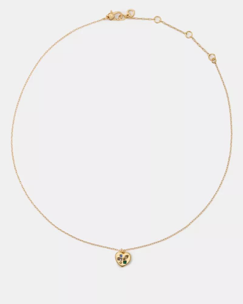 pingente self-love club em formato de cartão dourado multicolorido.