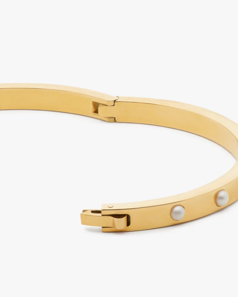 bracelete articulado com engaste em pedra em ouro branco.