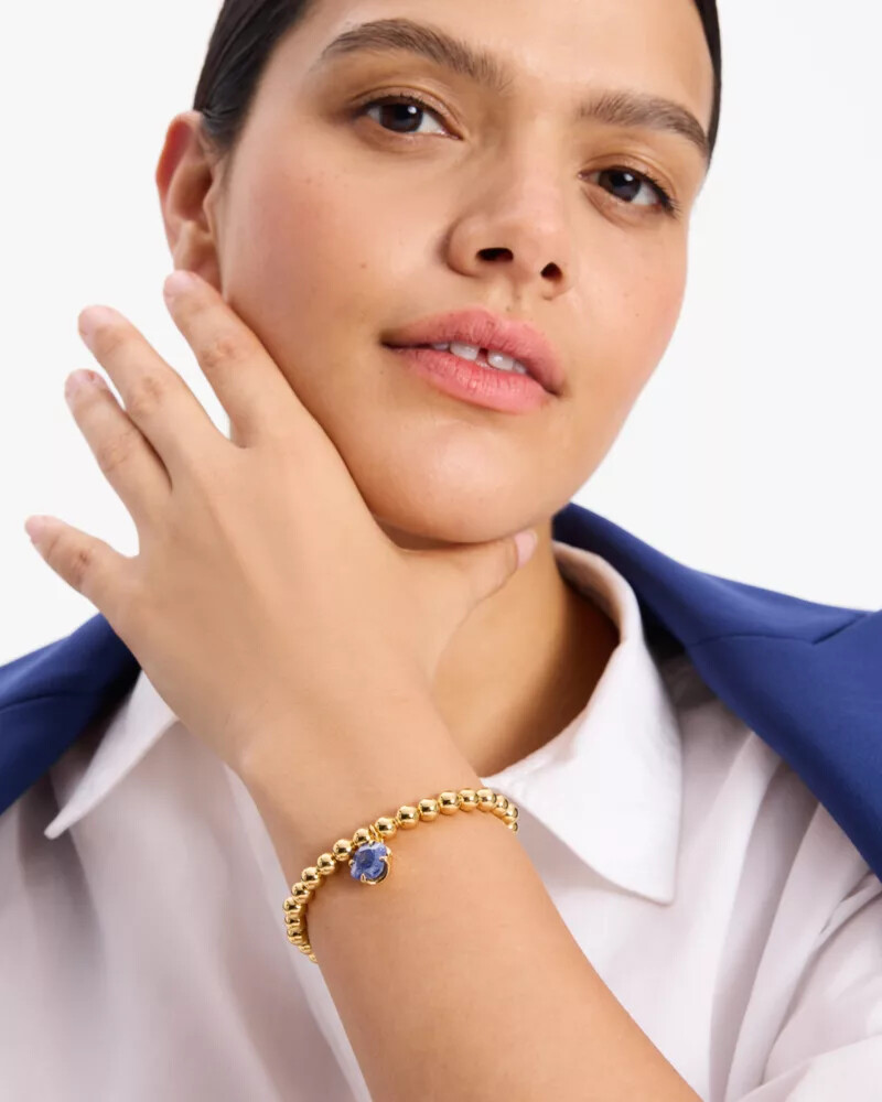 pulseira elástica pop of joy com flor de espadas azul marinho escuro