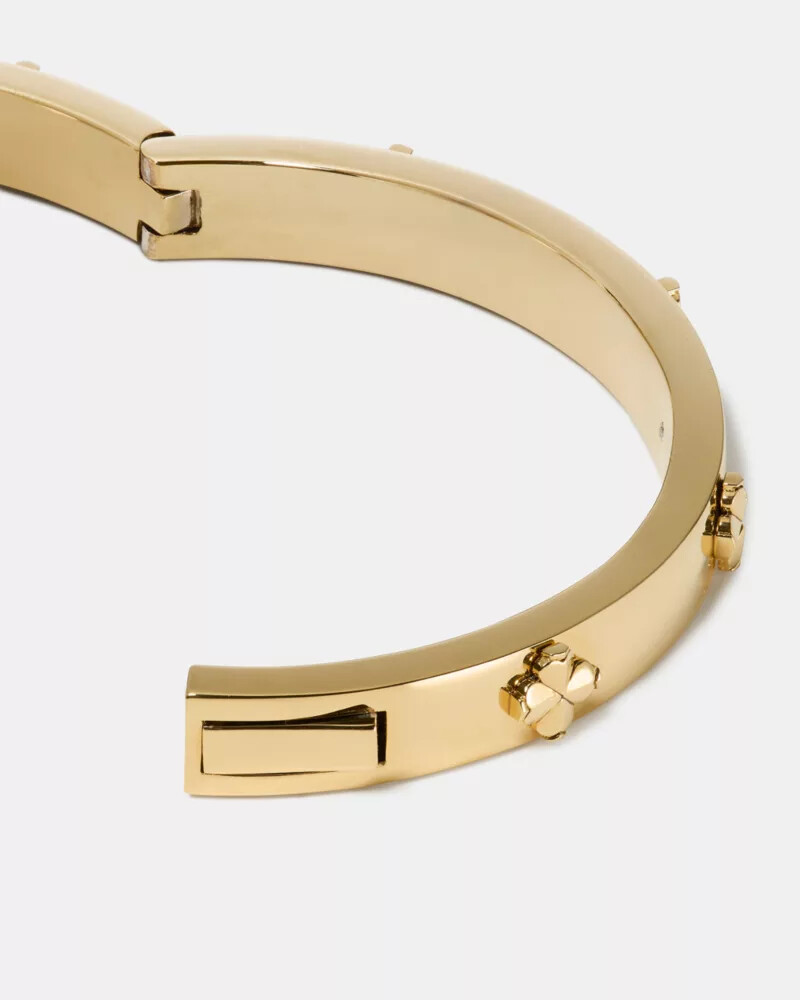 pulseira articulada dourada com flor de pá