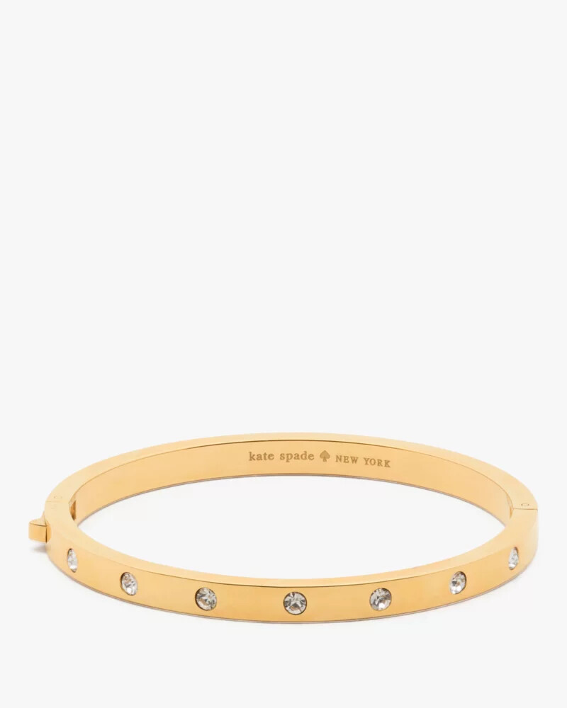 pulseira articulada dourada com detalhes em pedra.