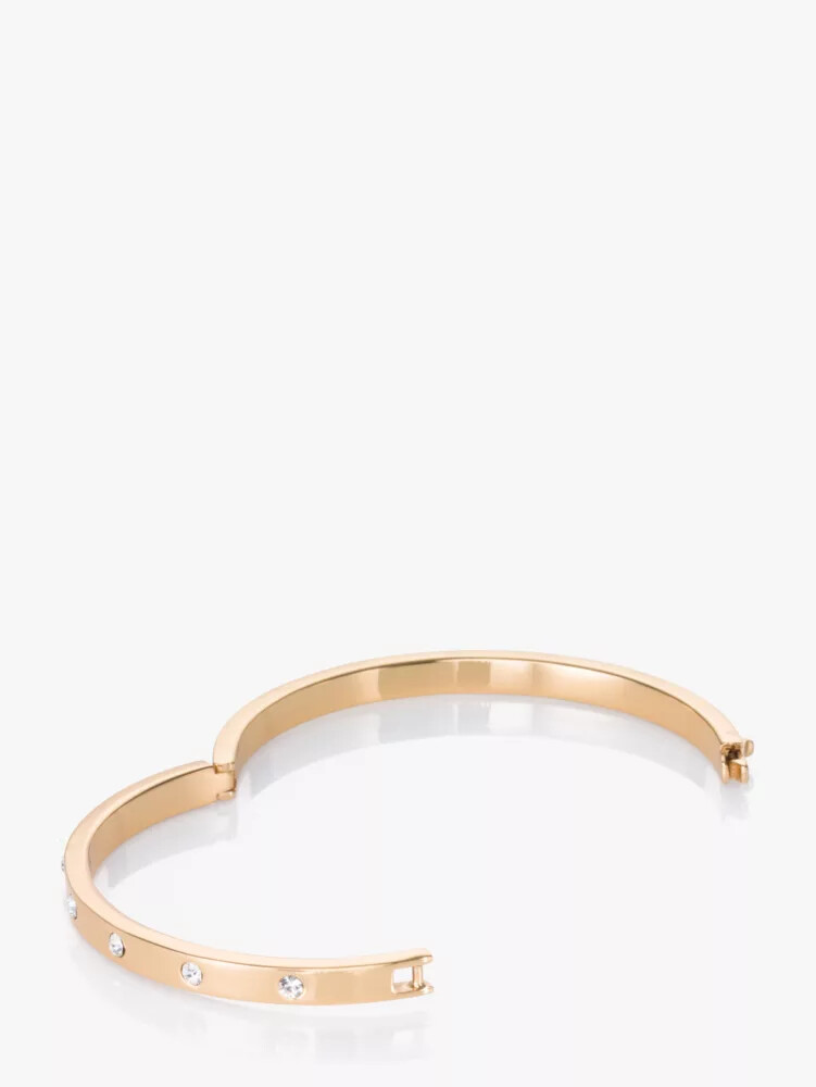 pulseira articulada dourada com detalhes em pedra.
