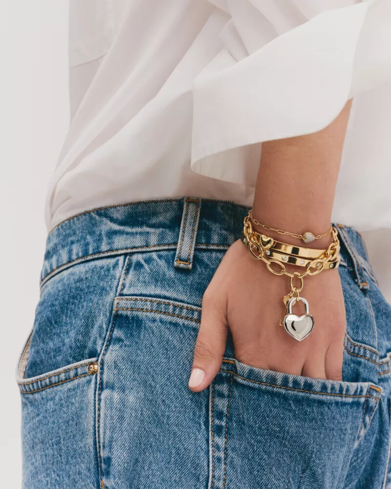 pulseira articulada dourada com detalhes em pedra.