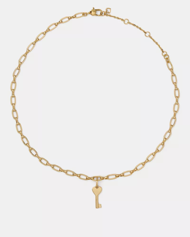 pingente de chave dourado
